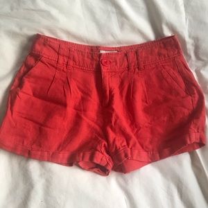 Orange pleated shorts